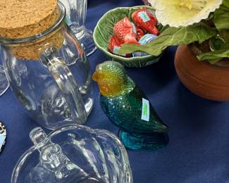 Green ceramic parrot figurine and glass canister