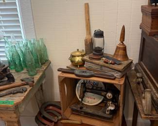 Green Coca-Cola bottles on primitive painted table