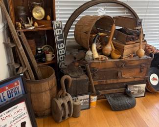 Primitive corner with wooden trunk, bushel basket and gourd dippers