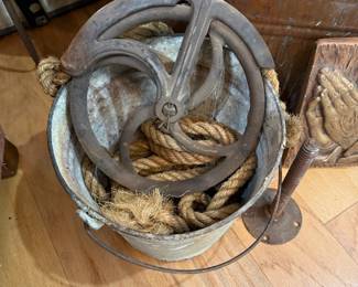 Cast iron barn pulley and rope in galvanized bucket