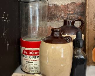 Dr. LeGear's Udder Ointment tin and St. Joseph aspirin box