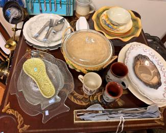 Assorted serveware with glass leaf dishes and silverplate tray