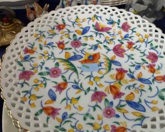 Set of reticulated floral porcelain plates with gold rim