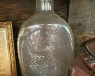 Antique embossed clear glass flask with cork