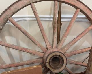 Antique wooden wagon wheel with red paint