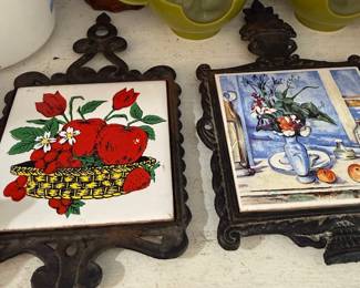 Cast iron tile trivets, fruit and floral