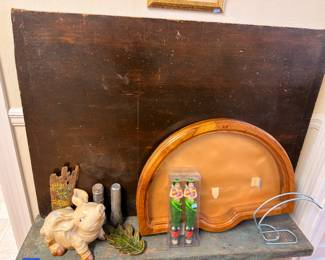 Ceramic pig figurine with arched oak mirror frame