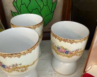 Set of three floral porcelain egg cups