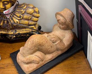 Carved stone reclining figure sculpture