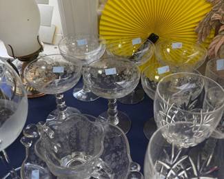 Etched crystal champagne coupes and cut crystal goblets