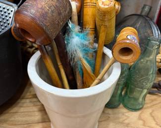 Antique wooden mashers and utensils in stoneware crock