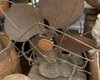 Antique electric fan with metal blades and cage
