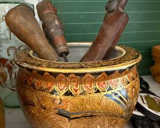Gilt ceramic jardiniere with antique wood tools