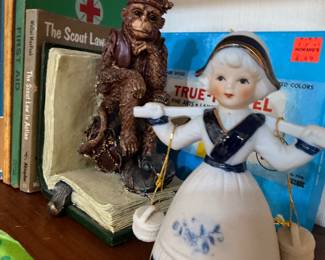 Porcelain Dutch girl bell and monkey bookend