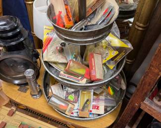 Three tier stand of vintage fishing lures