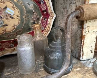 Antique wrench, hand tools and glass bottles
