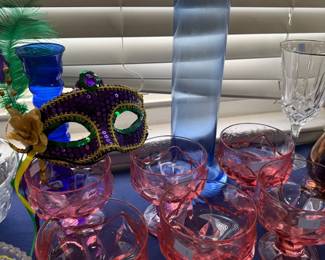 Pink depression glass sherbets with Mardi Gras mask
