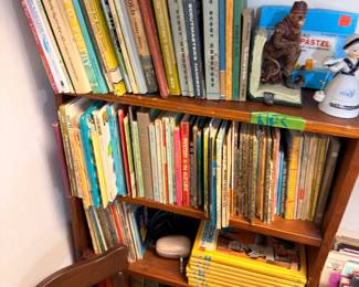 Shelves of vintage children's books and Boy Scout handbooks