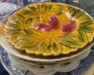 Majolica style grape leaf plate on transferware stack