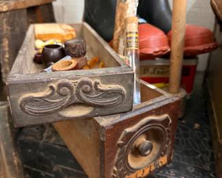 Carved sewing machine drawers holding estate pipes and cigars