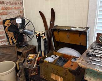 Military footlocker with wooden skis and antique fan