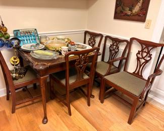 Mahogany dining table with Chippendale-style chairs