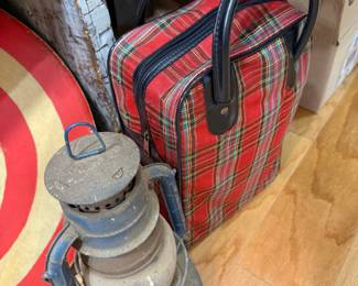 Vintage barn lantern with red tartan travel bag