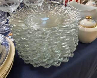 Stack of scalloped pressed glass luncheon plates