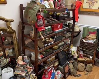 Primitive shelf with vintage tins and red barn lantern