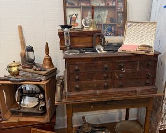 Antique machinist tool chest with oil lamp and hand tools