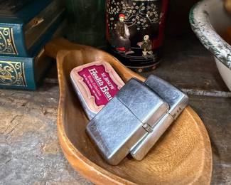 Pair of vintage chrome pocket lighters in wood dish