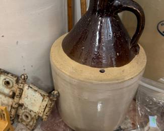 Antique stoneware whiskey jug with cork stopper