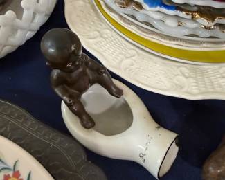 Bisque baby figurine with porcelain dish