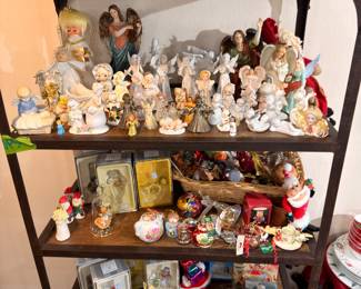 Etagere of angel figurines and Christmas collectibles