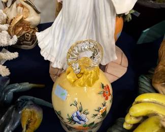 Yellow floral ceramic ewer with applied glass handle