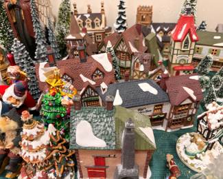 Christmas village buildings with bottle brush trees