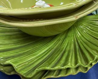 Green majolica style leaf plates and serving bowls