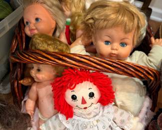 Basket of vintage dolls with Raggedy Ann