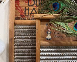 Antique Columbus washboard with peacock feathers