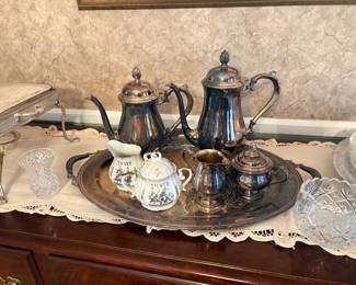 vintage silver-plated coffee and tea service set arranged on an engraved two-handled serving tray, featuring a mix of metal pots and commemorative ceramic pieces