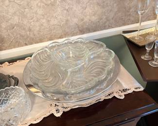 vintage mid-century Kromex rotating lazy susan features a polished chrome base with clear swirled glass divided relish trays and a matching center bowl