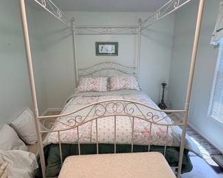 DHP White Metal Canopy Bed features an elegant European-inspired arched metal scrollwork design in a clean white finish