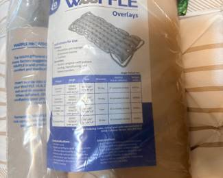 EHOB Waffle Expansion Control Mattress Overlay (Model 1004EC/1004ECP), which appears to be a beige, inflatable static air medical overlay packaged in clear plastic. It is designed for pressure injury prevention, patient comfort, and aiding caregivers with turning or repositioning