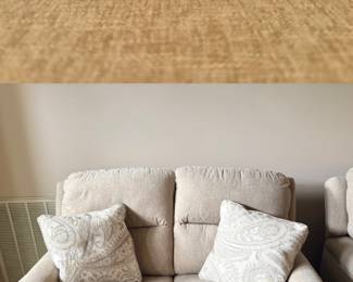 Havertys Ava Fabric Power Reclining Loveseat upholstered in a textured neutral oatmeal fabric with integrated metal power control buttons and a USB charging port