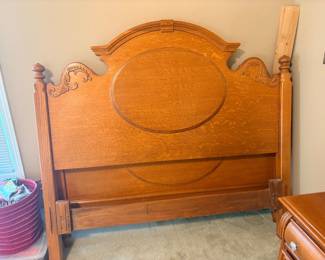 vintage solid oak queen bed frame from the Lexington Furniture Victorian Sampler Collection featuring classic Victorian-inspired carved scrollwork and an oval panel detail