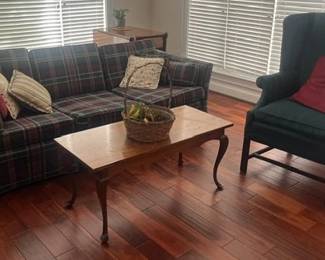Tartan Plaid Sofa, Vintage Queen AnneStyle Cherry Wood Coffee Table, and Dark Green Wingback Armchair