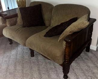 TraditionalStyle Loveseat with Tan Upholstery and Dark Wood Carved Arm Panels