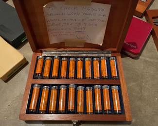 vintage machinist's wooden case filled with labeled glass vials containing calibrated thread-measuring 3-wire sets,