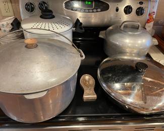 vintage heavy-duty cast aluminum cookware pieces, commonly referred to as aluminum roasters or Dutch ovens