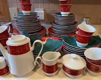 Chris Madden Montalira dinnerware set featuring a festive red and white design with intricate gold scroll accents. (2) 40pc dinnerware sets available (1) set of tea/coffee pot, cream/sugar dish, salt/pepper